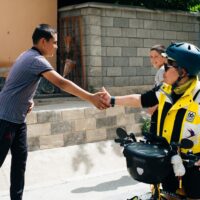Ah Gan Shaking Hands